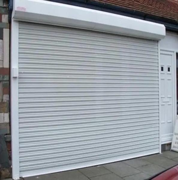 天津恒信電動門有限公司：卷簾門、電動卷簾門及電動車庫門專業(yè)制造商